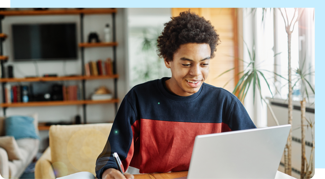 Image of young adult using a laptop.