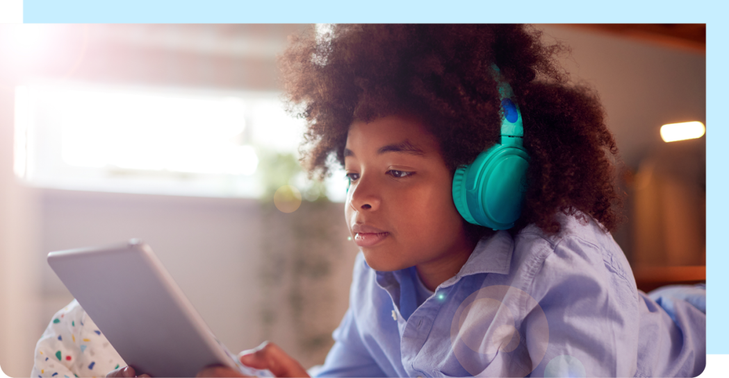 Image of child using a tablet.